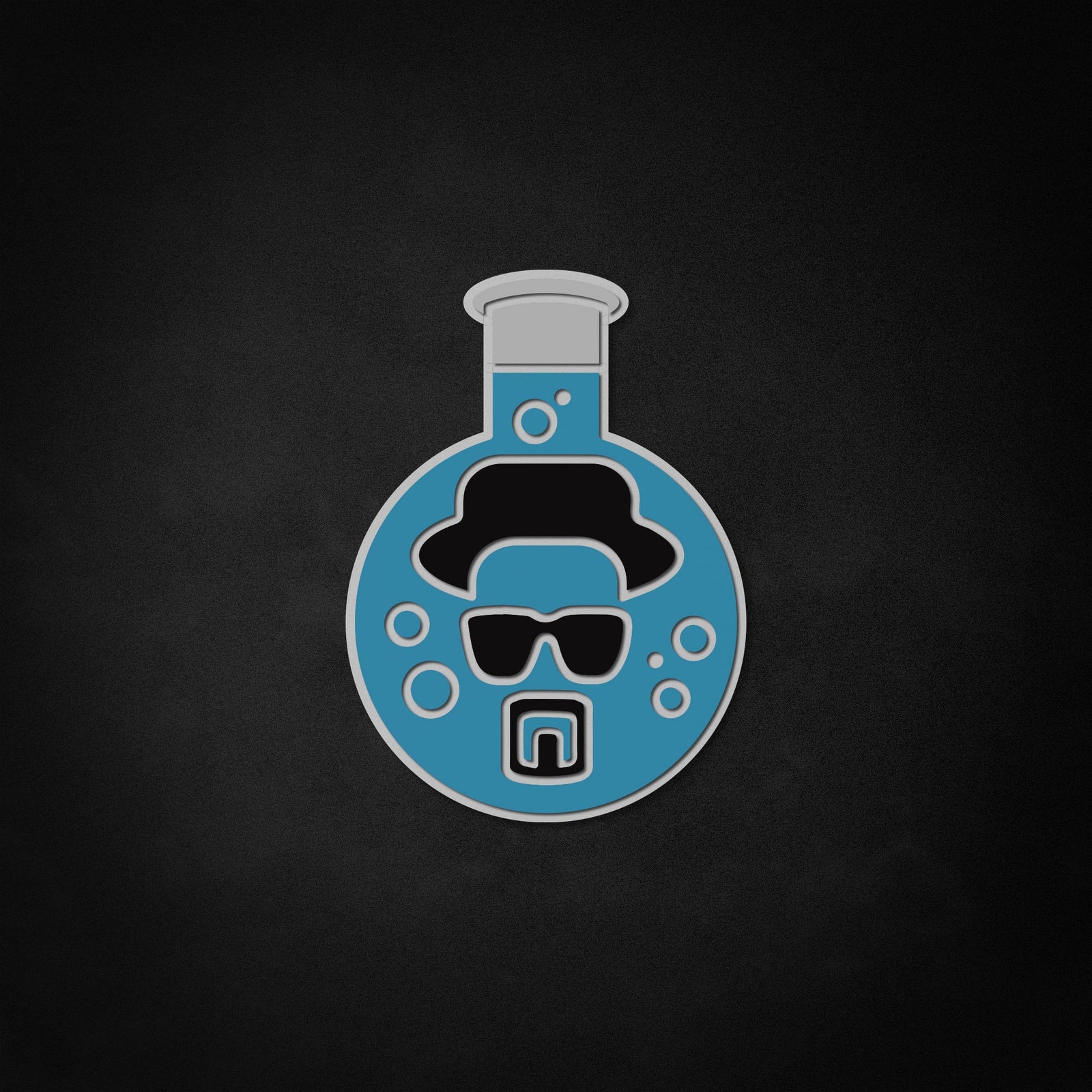 Close up view showing detail of Heisenberg character graphic glowing blue on a textured surface