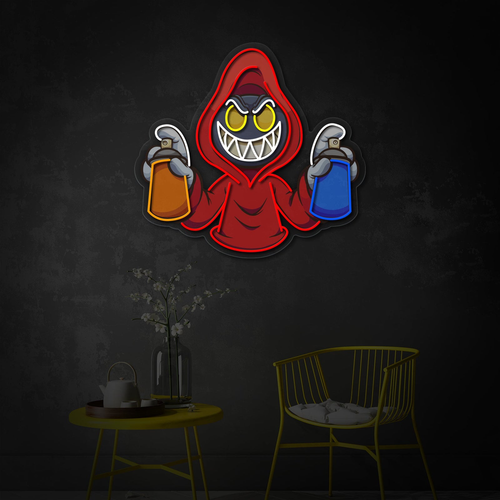 Close-up view of the Hooded Evil with Graffiti Spray Cans neon sign, showing the details of the UV print and LED tubing against a grey wall next to a yellow chair.