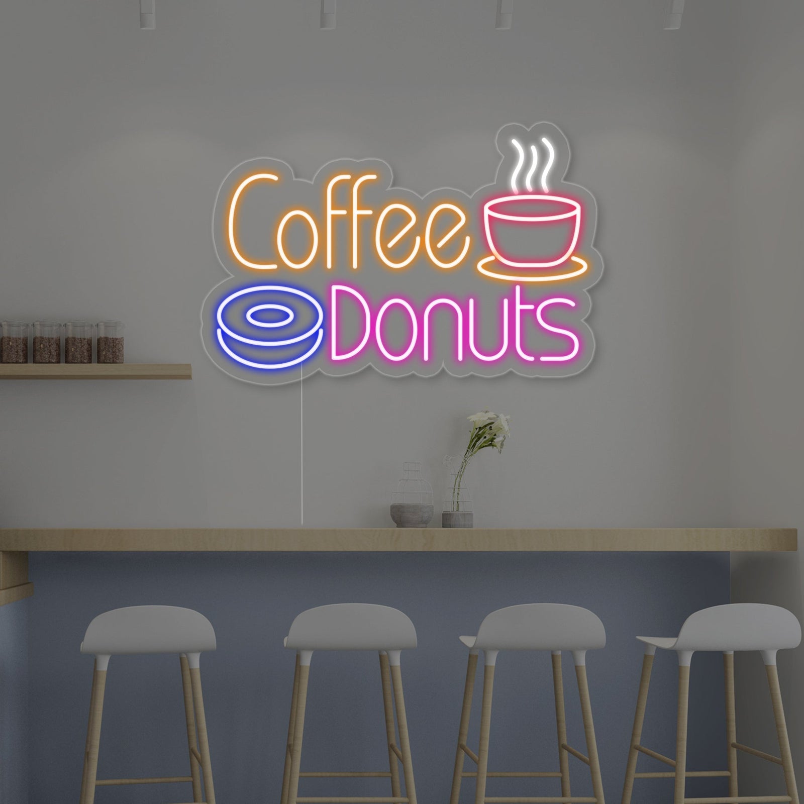 A neon sign displaying a vibrant donut and a warm, glowing coffee cup with steam on a detailed acrylic background.