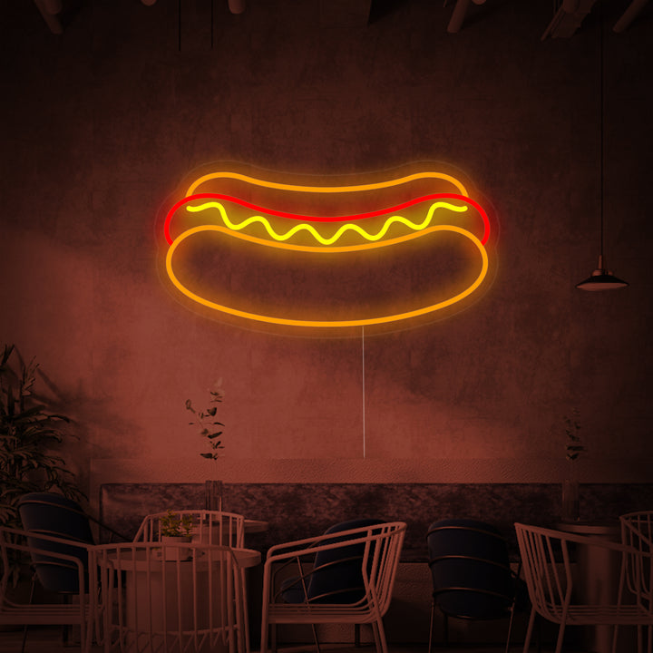 A hotdog restaurant neon sign illuminating a cozy diner counter area, viewed from a slightly high angle.