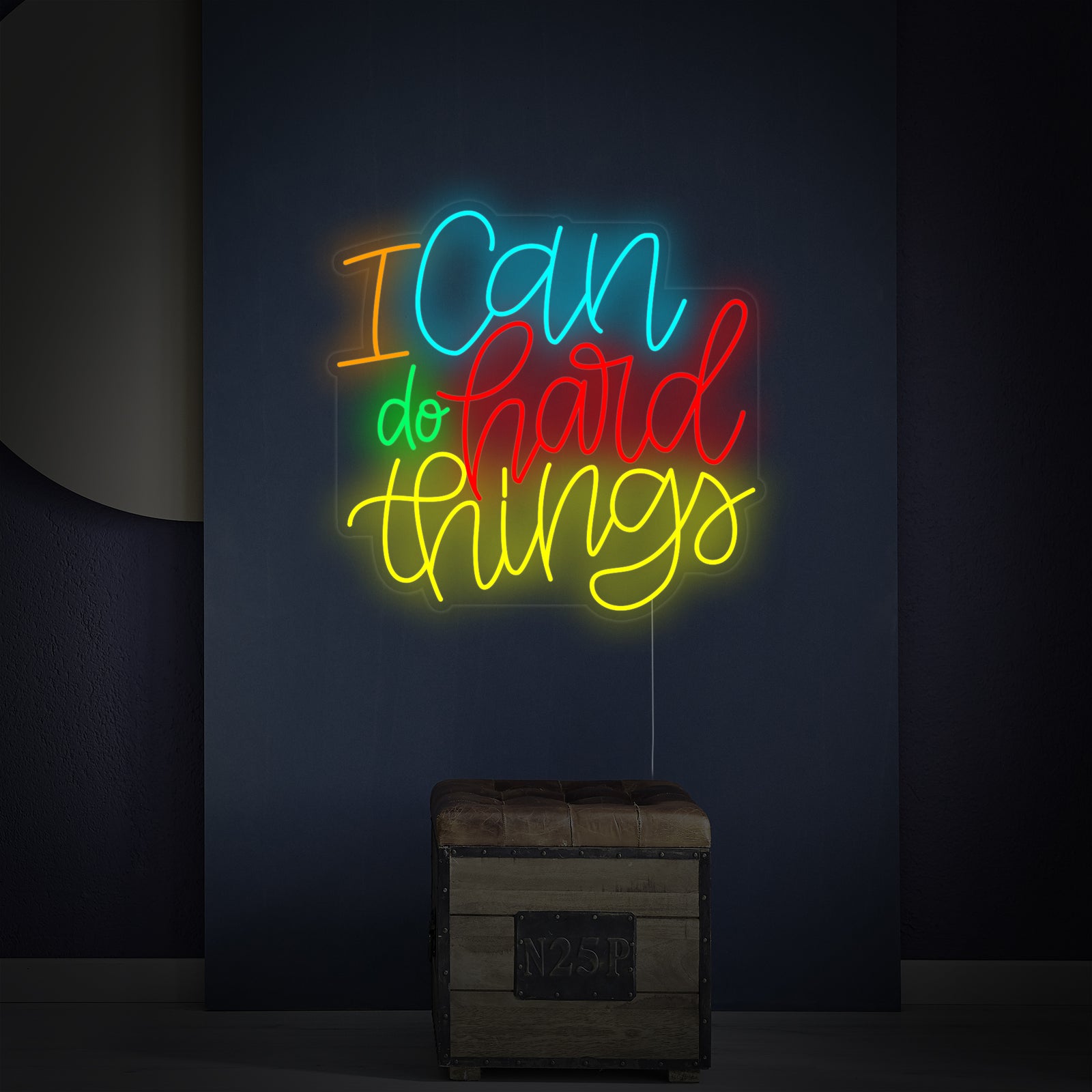 Close-up detail of the 'I Can Do Hard Things' neon sign showing the light tubes on an acrylic backing