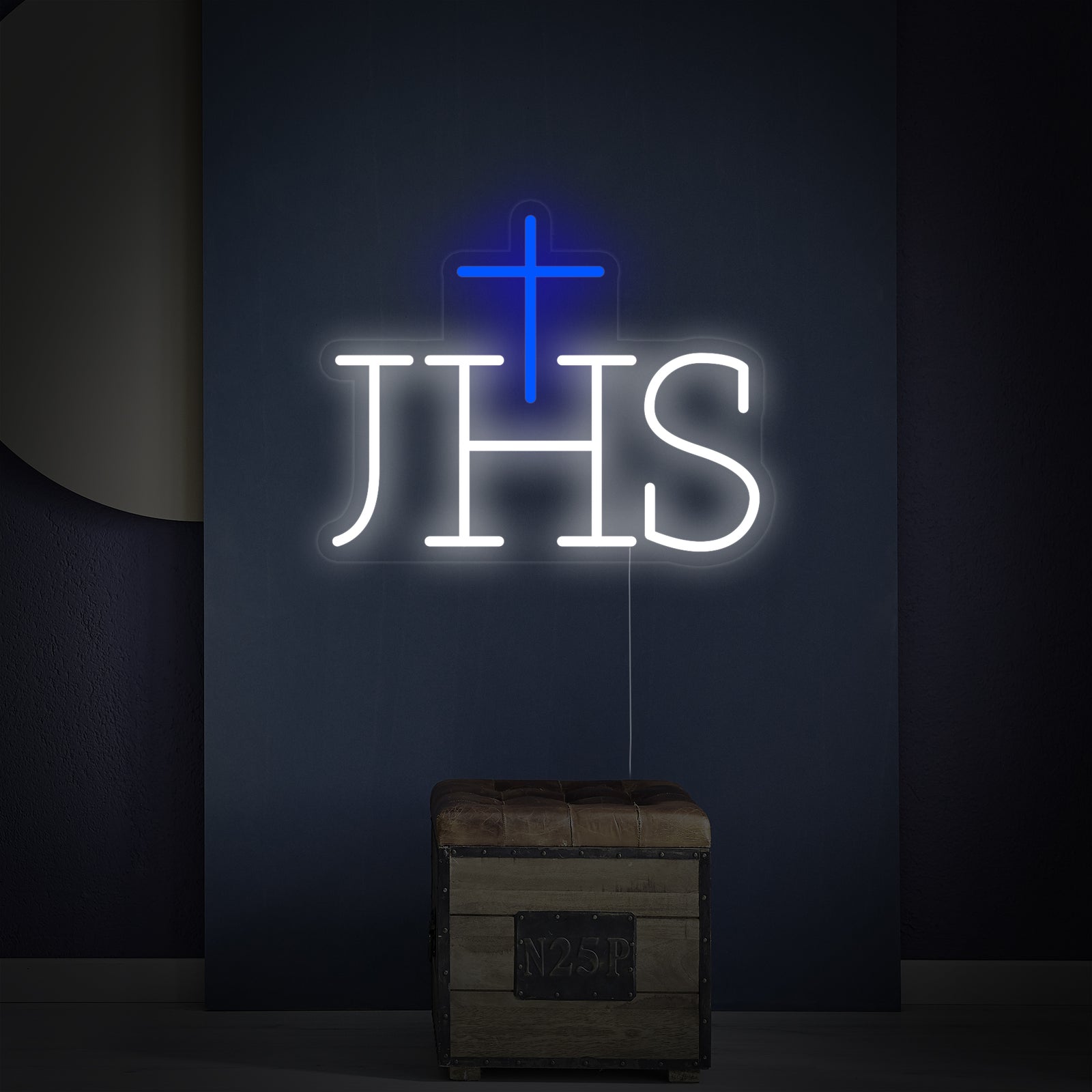 Close-up of the 'Ihs Jesus Symbol' neon sign, showing the detailed lettering and mount.