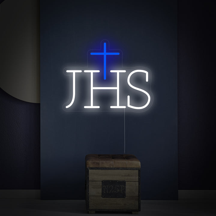 Close-up of the 'Ihs Jesus Symbol' neon sign, showing the detailed lettering and mount.