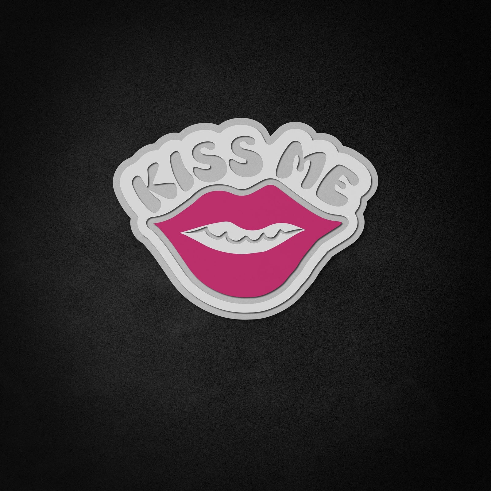 Close-up detail of Kiss Me neon-style sign text glowing pink on clear acrylic