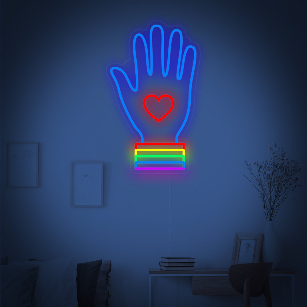 Close-up detail of the LGBT hand neon design, featuring the distinct pride colors.