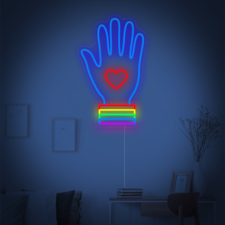 Close-up detail of the LGBT hand neon design, featuring the distinct pride colors.