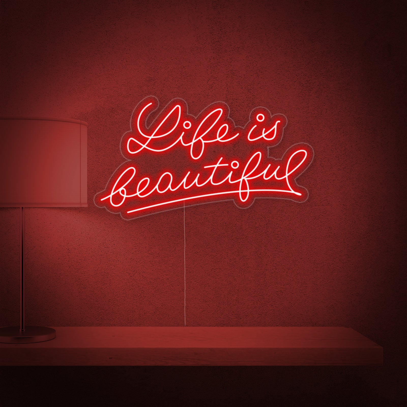A clean mockup view showing a lit "Life is Beautiful" neon sign in a scripted font, mounted against a plain wall surface.