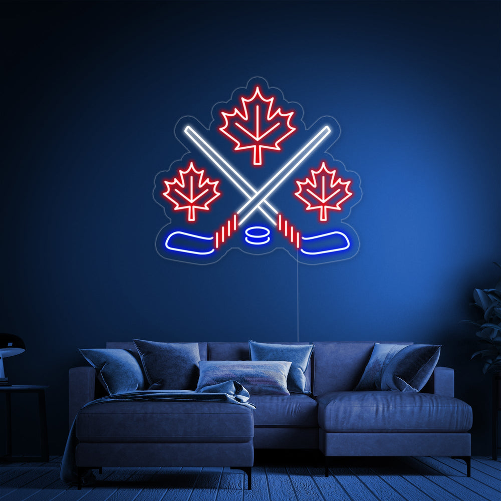 A perspective view of the 'Maple Leaves With Crossed Hockey' neon sign, showing the clear acrylic backing and hanging wire.
