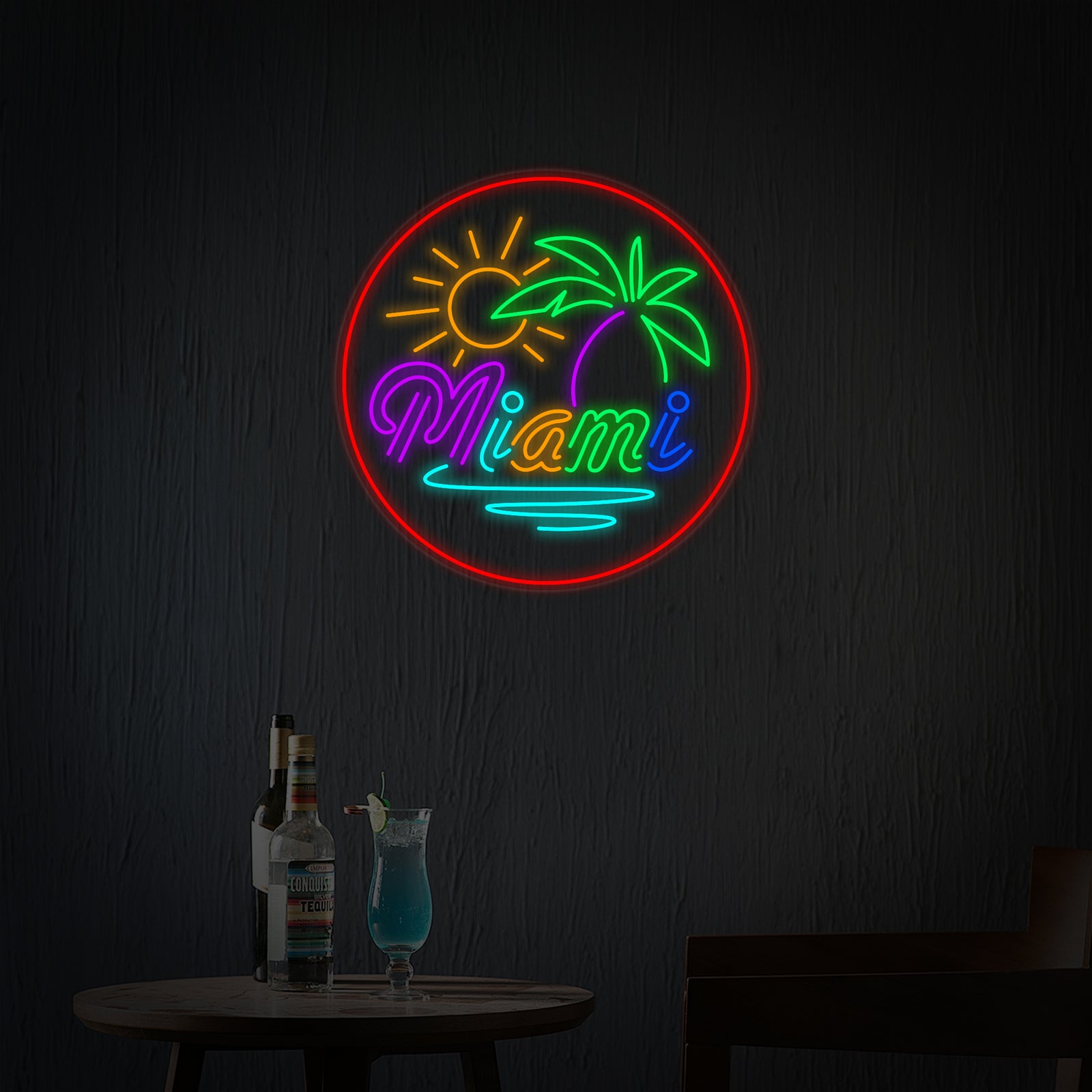 A front view of the 'Miami Beach Bar' neon sign with text framed by palm trees and a flamingo, glowing intensely against a blurred background.