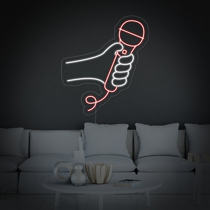 A clean graphic representation of a retro-style microphone glowing with bright neon lines and an visible outline mounting board.