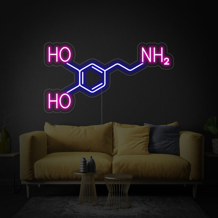 Close-up photograph of the Dopamine Molecule Neon Sign showing its glowing tubes forming the chemical structure, mounted on a clear acrylic backing.
