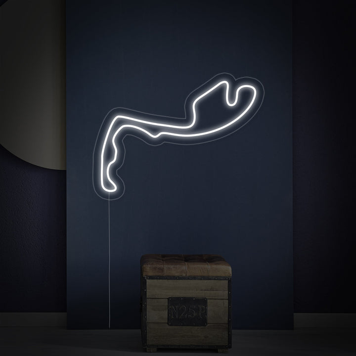 A clean visualization of the glowing white and blue "Monaco F1 Track" neon sign, showcasing the iconic circuit layout.