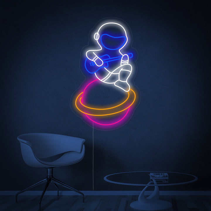 A detailed view of the musician astronaut neon sign design, featuring a spaceman playing guitar on a ringed planet.