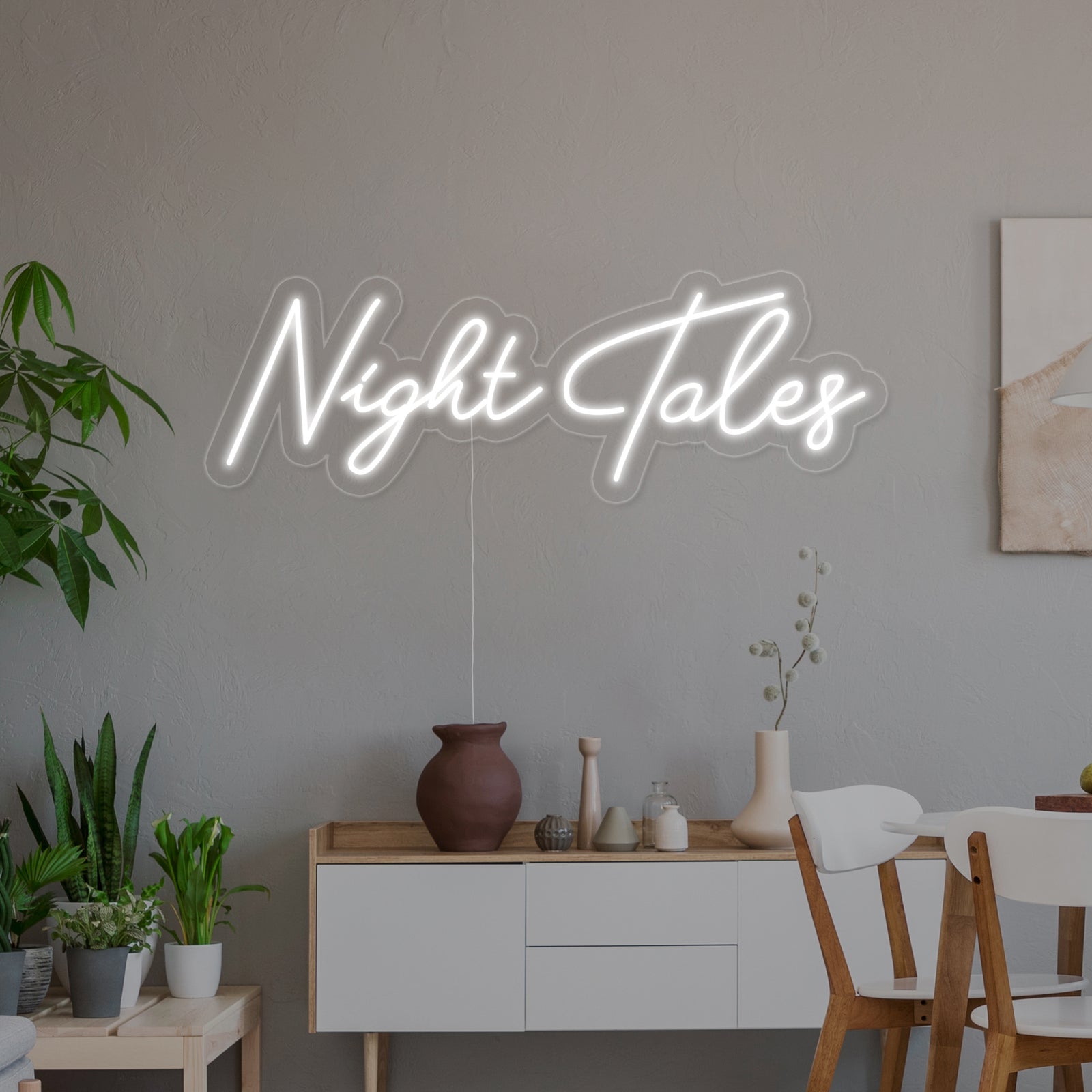 A stylized mockup view of the 'Night Tales' neon sign, demonstrating how it appears as glowing wall decor in a modern interior design context.