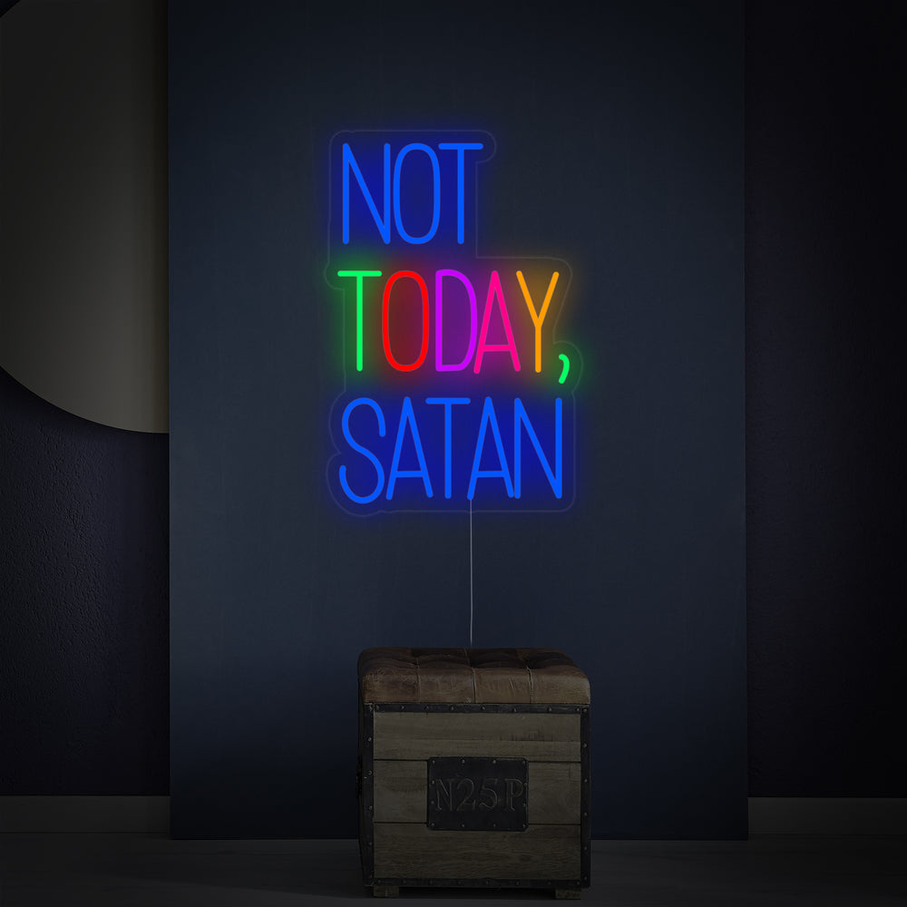 A close-up view of the 'Not Today Satan' neon sign, showing the detailed lighting, clear acrylic backboard, standoffs, and power cord.