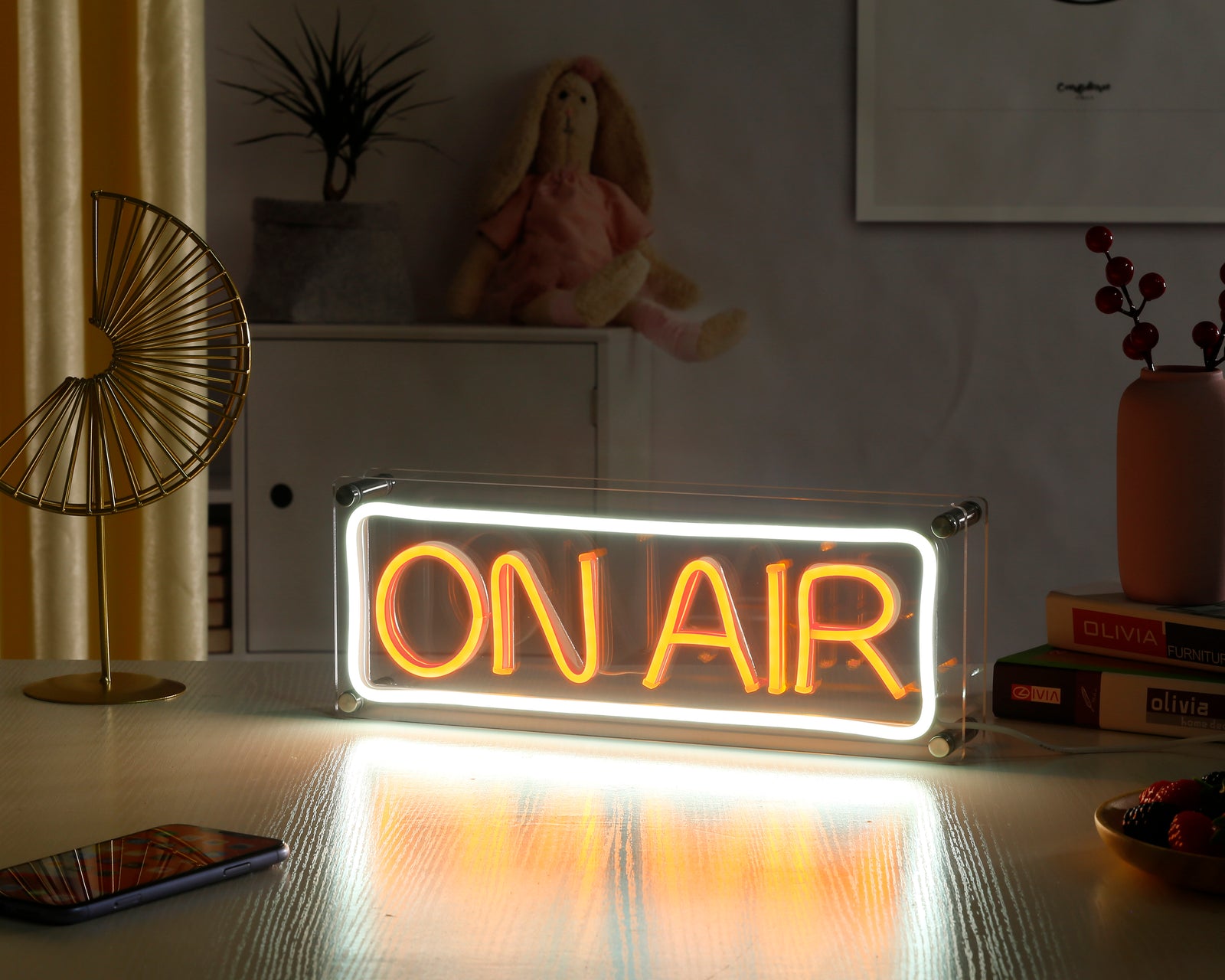 An unlit 'ON AIR' desk neon sign featuring a red acrylic box and glowing white letters on a black base.