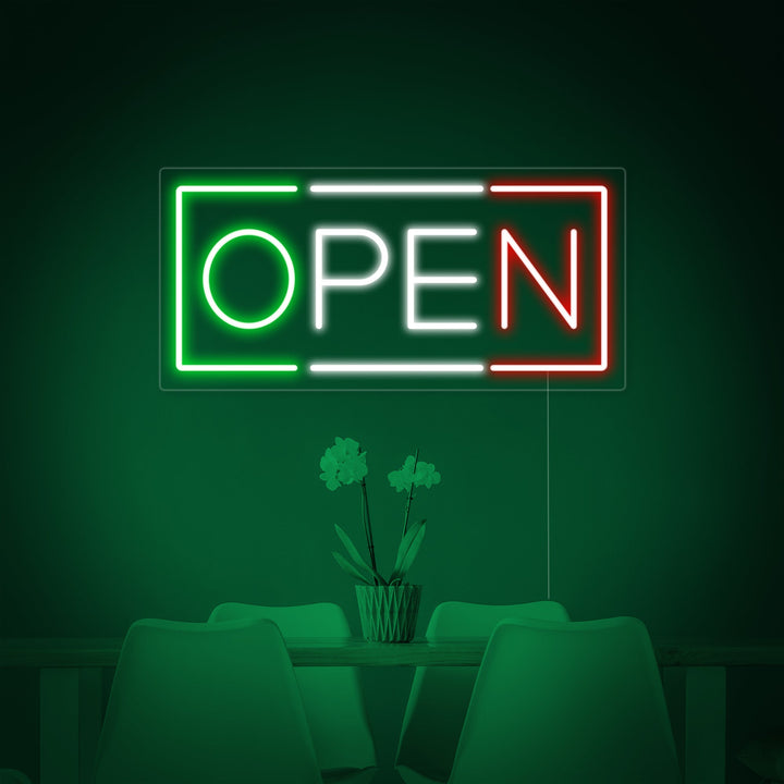 Close-up photograph of the handcrafted blue and red neon tubing and wiring of the 'OPEN ITALIAN RESTAURANT' sign on a dark background.