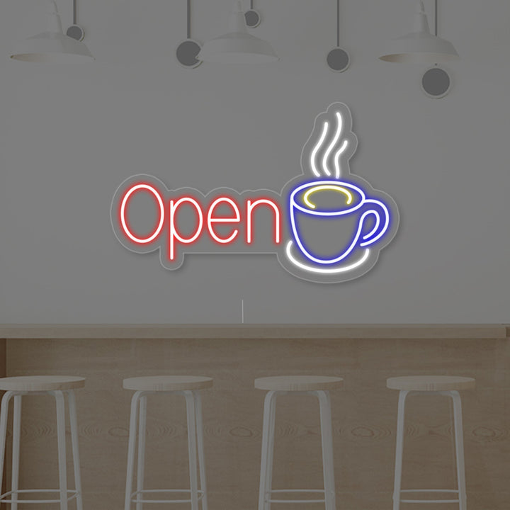 The 'Open Coffee' neon light design, featuring a warm glowing coffee cup and the text 'OPEN COFFEE' against a blurred cafe interior background.