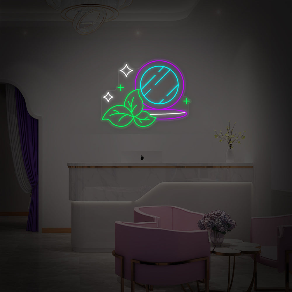 A glowing blue and pink neon sign that reads 'Organic Cosmetics Makeup Powder' mounted against a grey textured brick wall in an office environment.