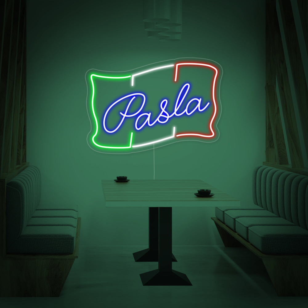 'PASTA' neon sign glowing on a textured brick wall, showcasing its bright light and design.