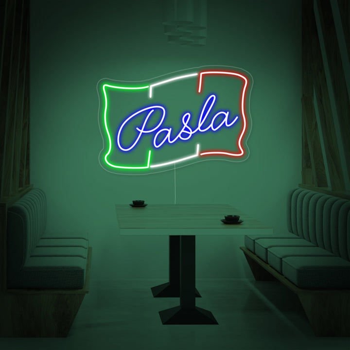 'PASTA' neon sign glowing on a textured brick wall, showcasing its bright light and design.