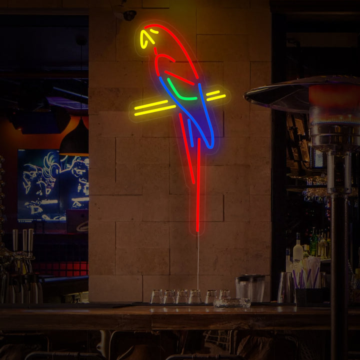 A detailed product shot of the Parrot Bar Pub neon sign, showing the multi-colored neon tubes forming the parrot and lettering.