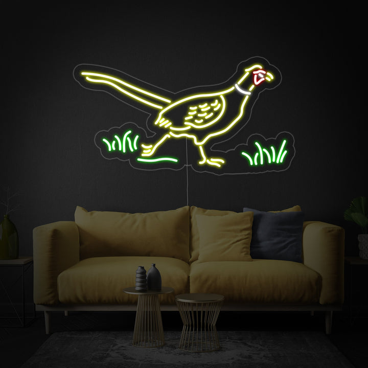 A glowing green neon sign shaped like a pheasant mounted on a light-colored wood panel wall.