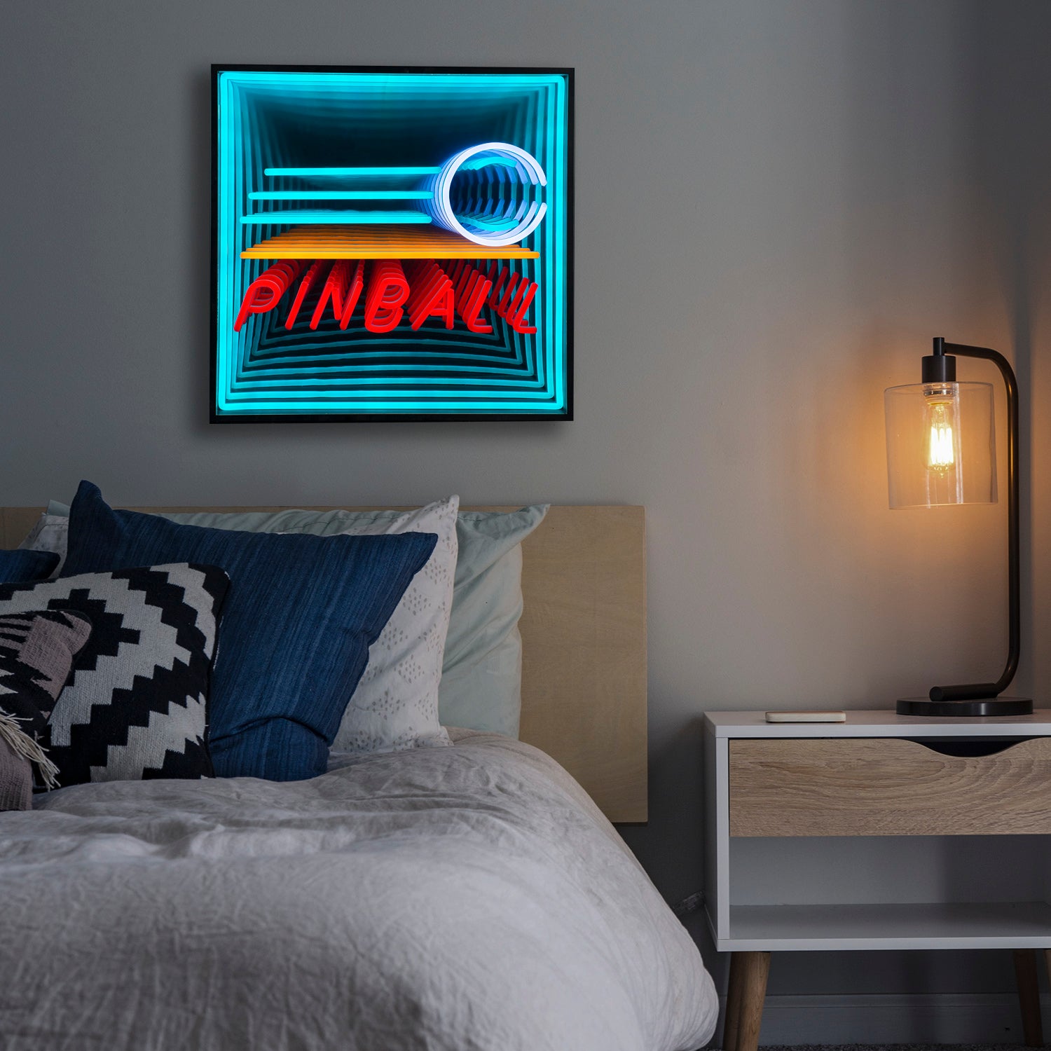 Mesmerizing 3D infinity neon sign shaped like a pinball machine playing field mounted on a wall in a contemporary bedroom.