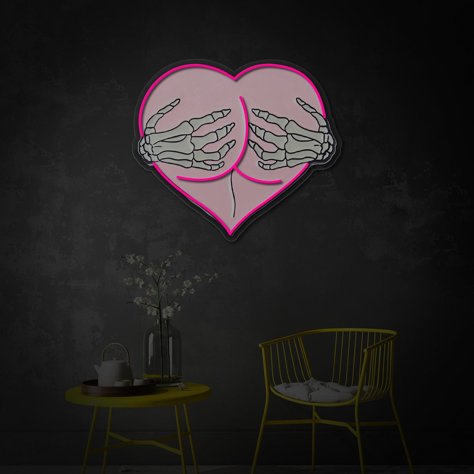 A close-up view of the Pink Heart Butt Hug Skeleton Hands UV Print LED Neon Sign glowing against a dark, artistic backdrop.