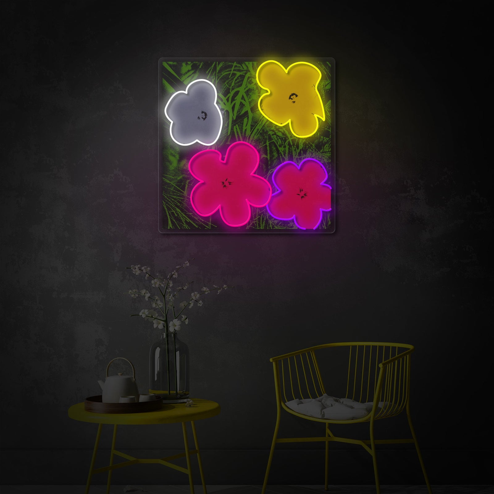 A close-up view of the Pop Art In Bloom neon sign glowing in a softly lit room above a chair.