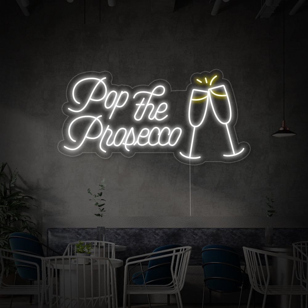Detailed shot of the 'Pop the Prosecco Cheers' neon wall decor showing the tubing structure and acrylic backing.