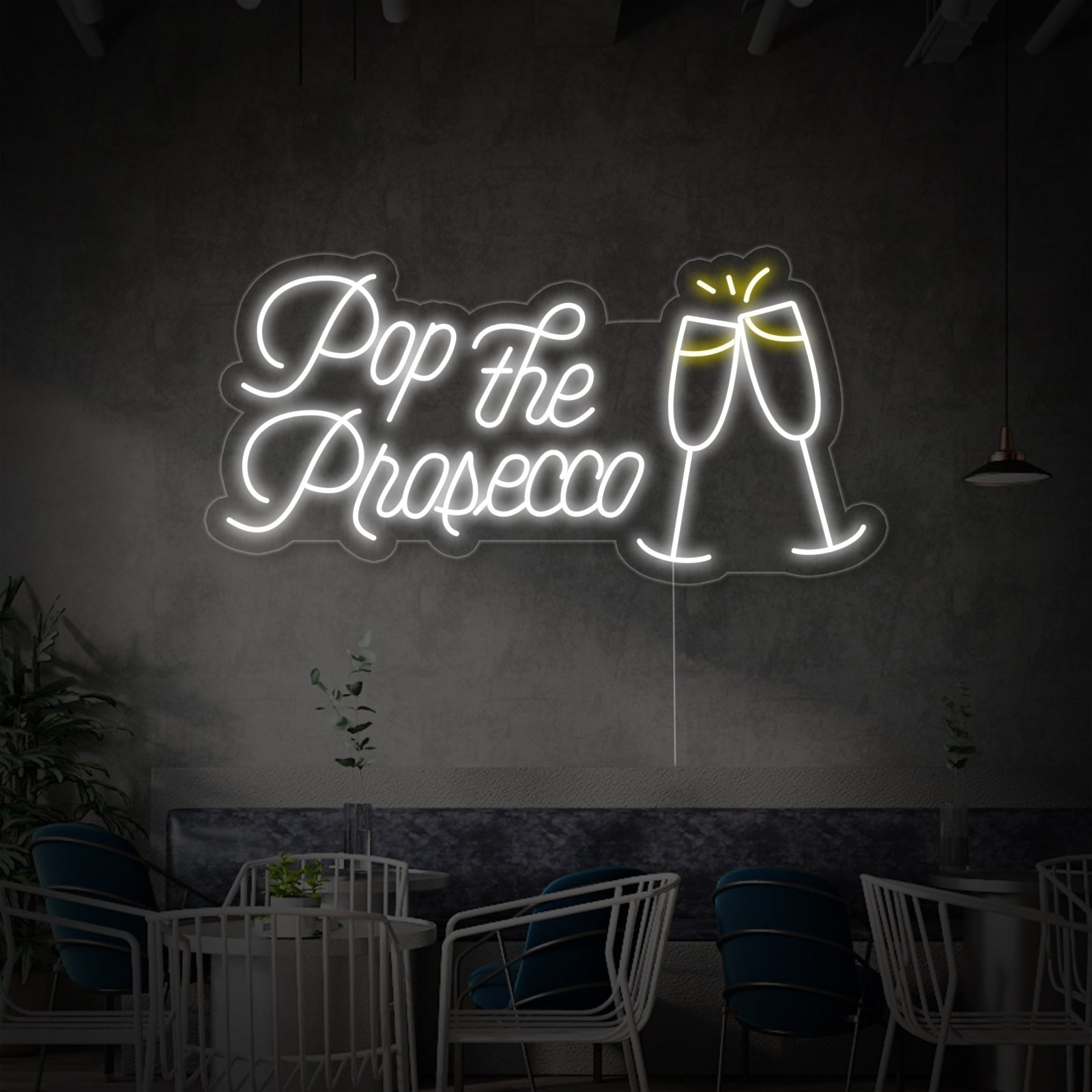 Detailed shot of the 'Pop the Prosecco Cheers' neon wall decor showing the tubing structure and acrylic backing.
