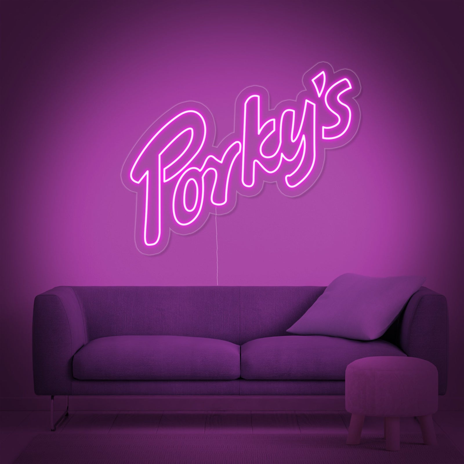The 'Porky' neon sign illuminated in a modern, purple-themed room.