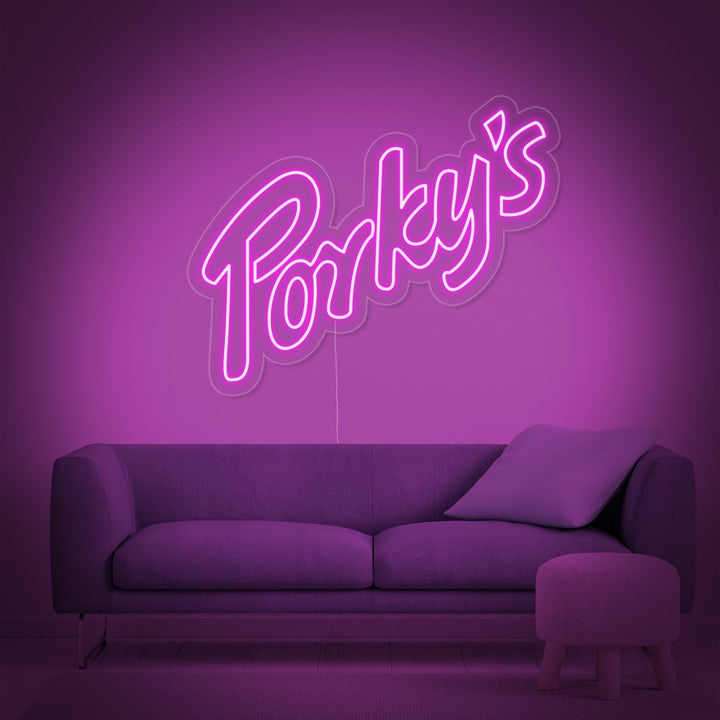 The 'Porky' neon sign illuminated in a modern, purple-themed room.