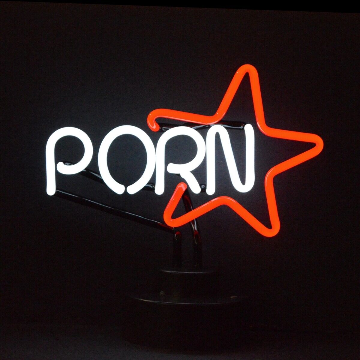 A glass table neon sign displaying the words "Porn Star" in glowing text with classic tubing and a dark base.