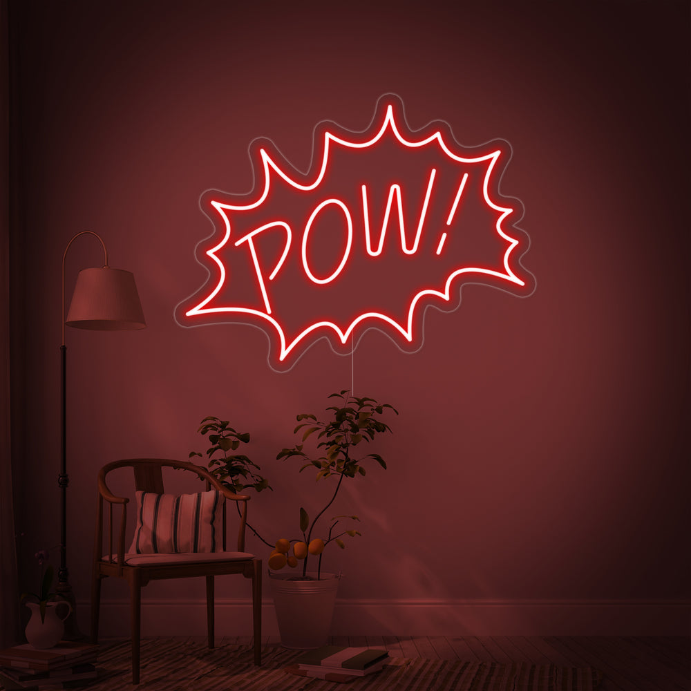 Close-up mockup of the 'Pow' neon sign design with realistic tubing on a clear acrylic backing, set against a blurred interior wall.