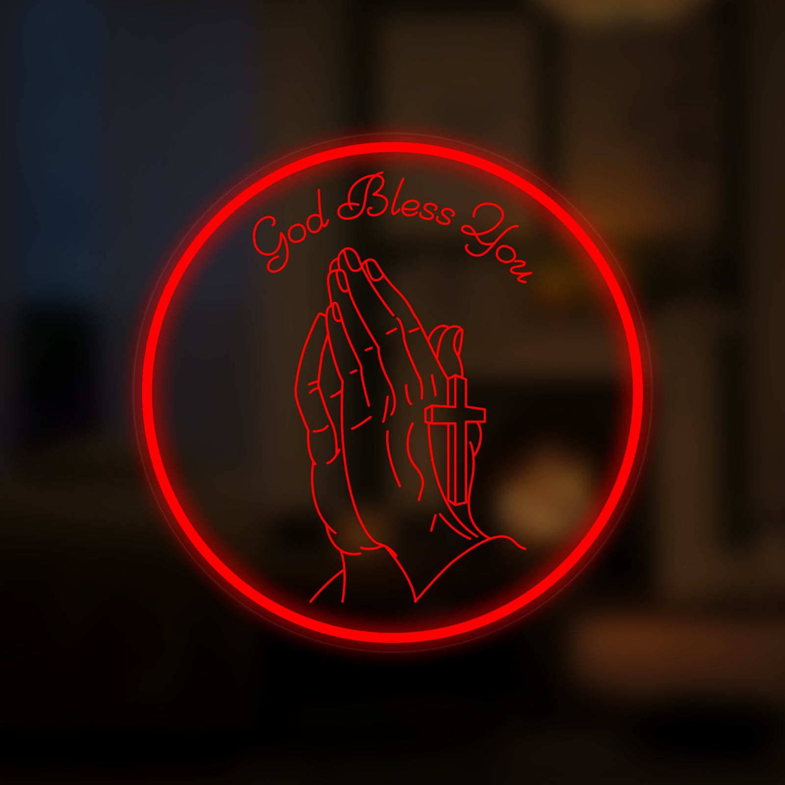 A glowing 'Prayer Hand With Cross' neon sign illuminated against a blurred interior background.