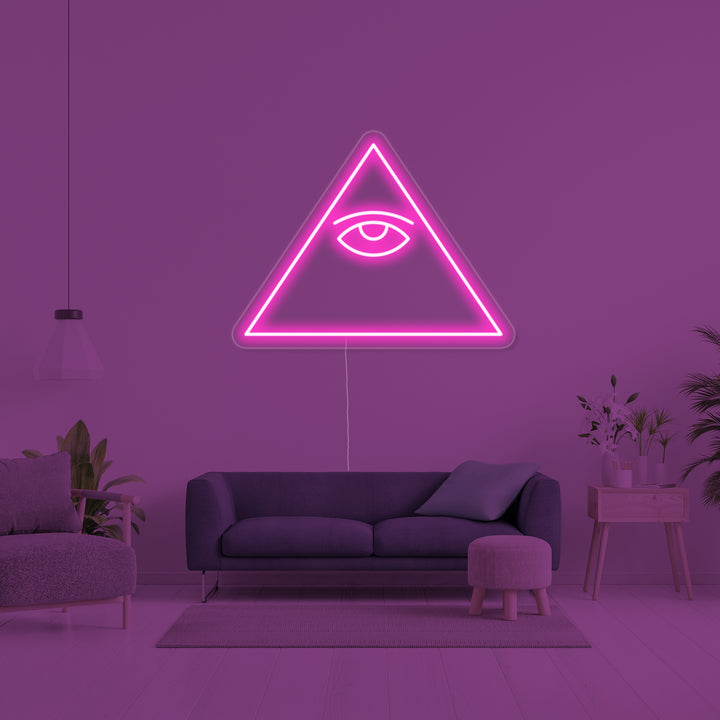 A glowing blue and red 'Psychic Eye' neon sign on a clear mounting backboard, viewed slightly from the side.