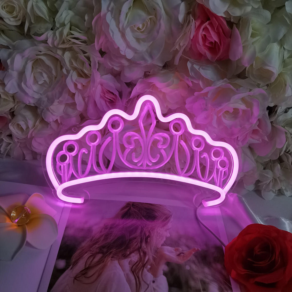 Closeup shot of the physical Queen Crown mini neon sign unlit, showing the intricate tubing and clear acrylic backing.