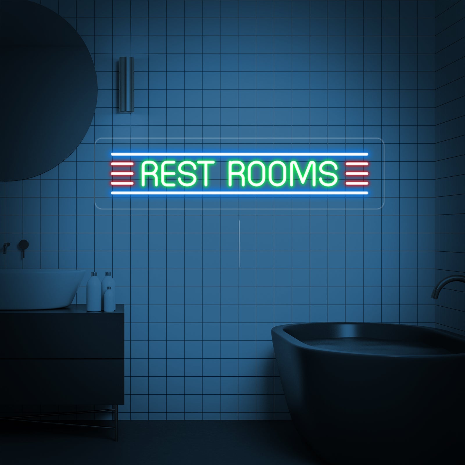 The glowing 'RESTROOM' neon sign is displayed above a sink in a stylishly designed bathroom interior, highlighting the aesthetic impact of the clear backing and bright light.