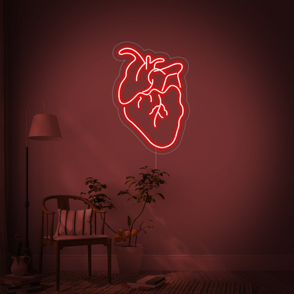 Close-up photograph of the Actual Heart neon sign design, showcasing the detailed anatomical tubes and mounting hardware.