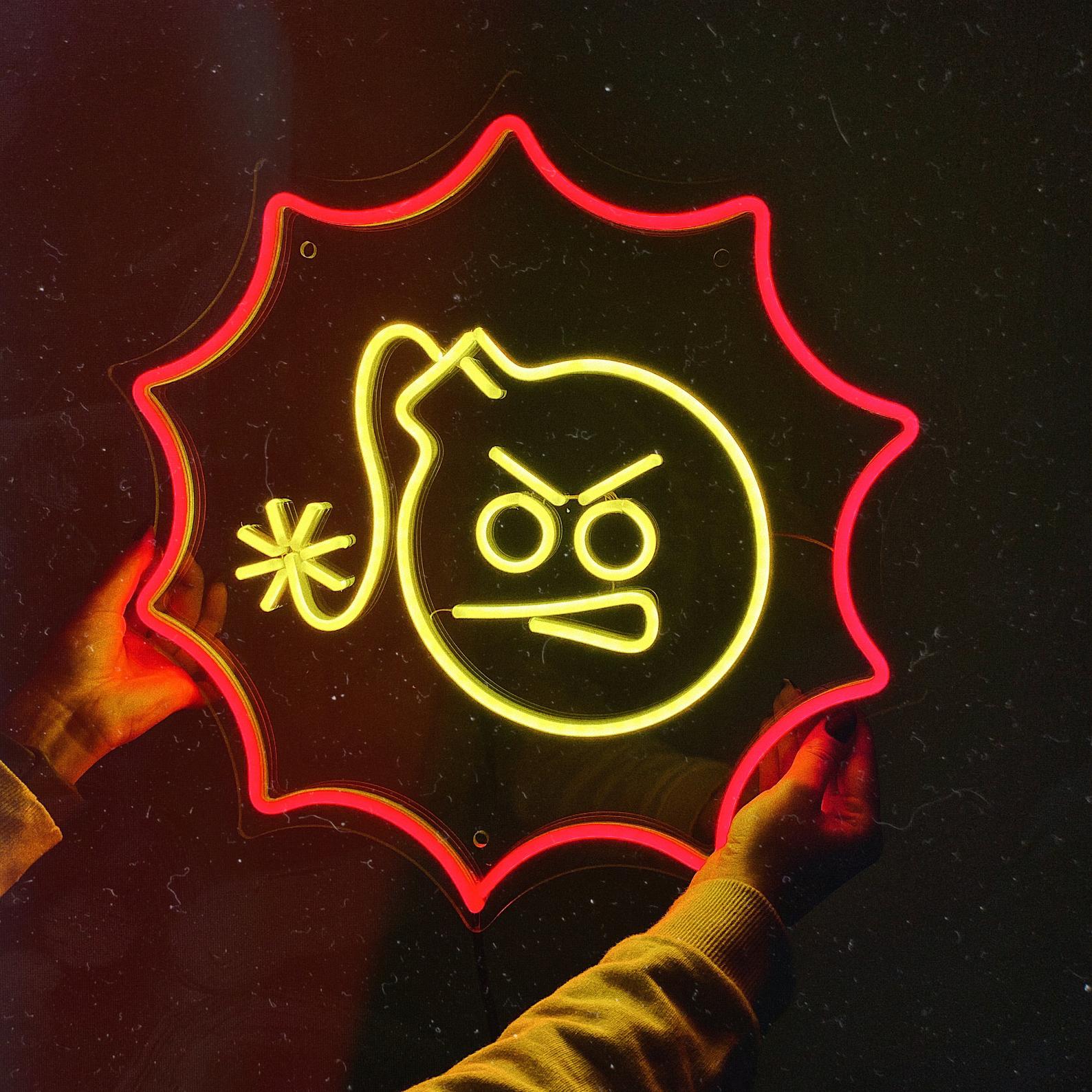 Handcrafted Serious Sam logo neon sign glowing blue on an acrylic backer being held by hands.
