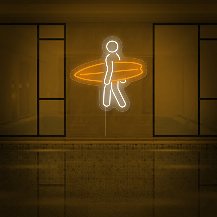 Close-up photograph of a detailed 'Surfing' neon sign glowing brightly on a wall.