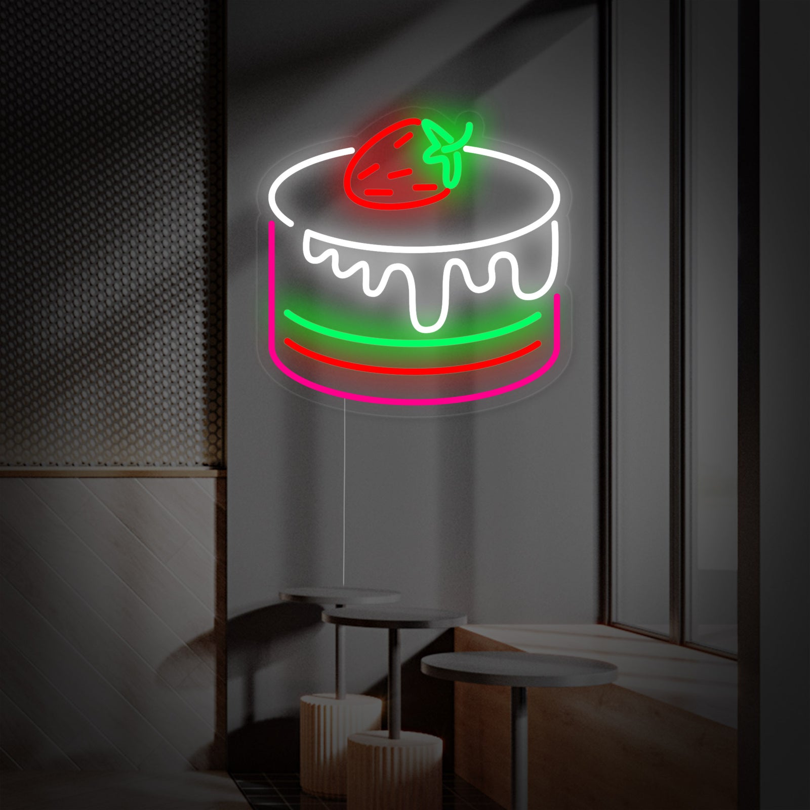 A bright, stylized neon sign showing a cake with strawberries on top over a clean acrylic backing mounted on a simple background.
