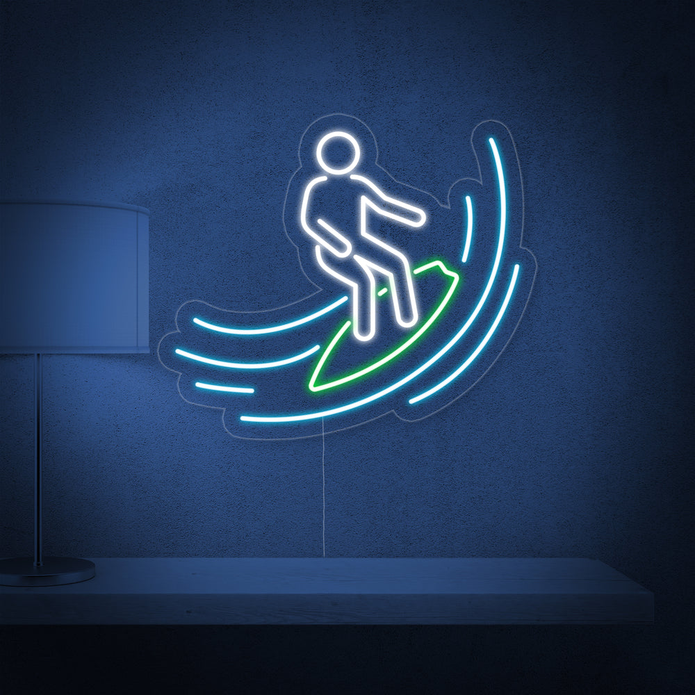 A realistic product shot of a hand-crafted neon sign featuring a surfer silhouette and a rolling wave.