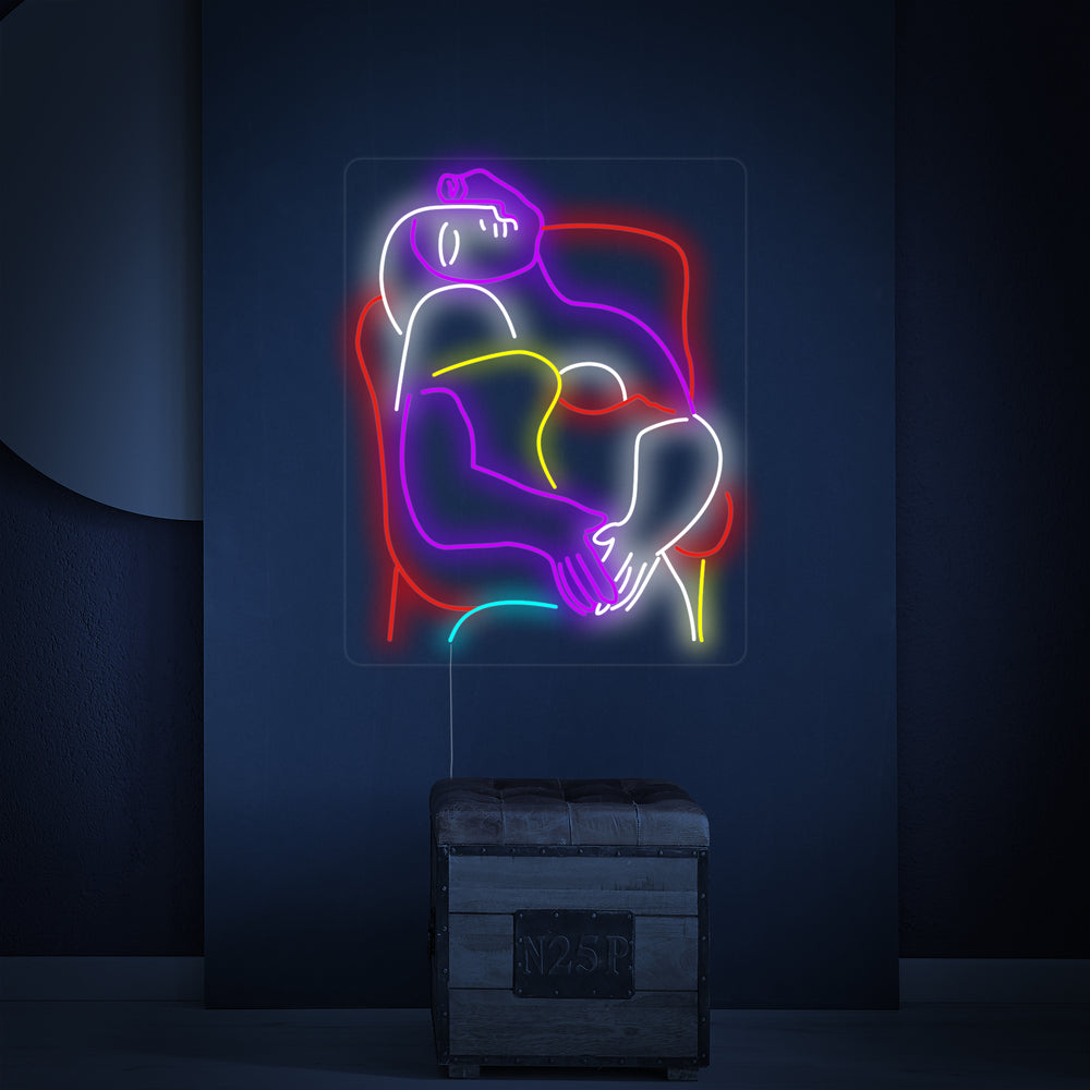 Closeup of the glowing 'The Dream Pablo Picasso' neon sign, showcasing its intricate tube design on a clean wall.