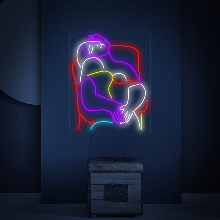 Closeup of the glowing 'The Dream Pablo Picasso' neon sign, showcasing its intricate tube design on a clean wall.