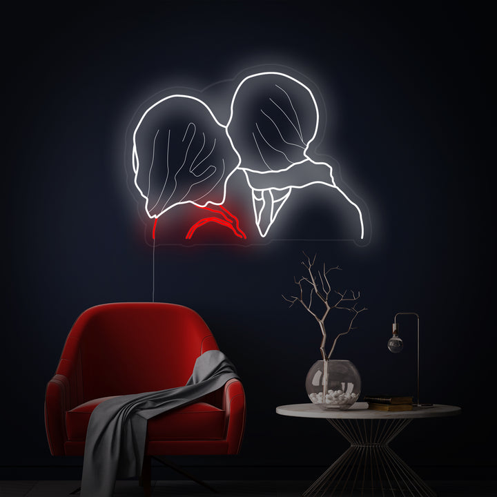 The Lovers René Magritte neon sign is prominently displayed, showing the clear acrylic backplate and glowing design elements in a detailed interior mockup.