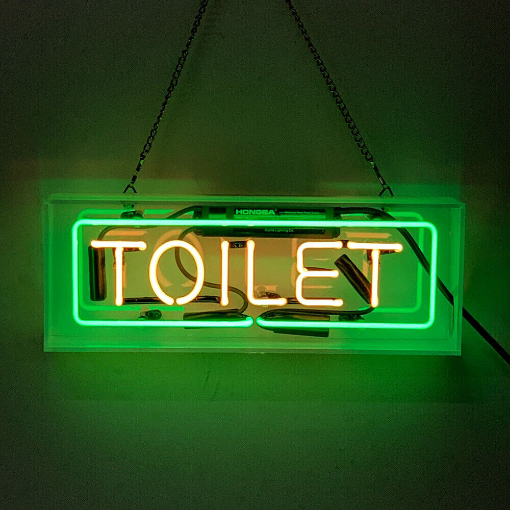 A free-standing 'Toilet' neon sign enclosed in a clear acrylic box, displaying glowing white glass tubing.