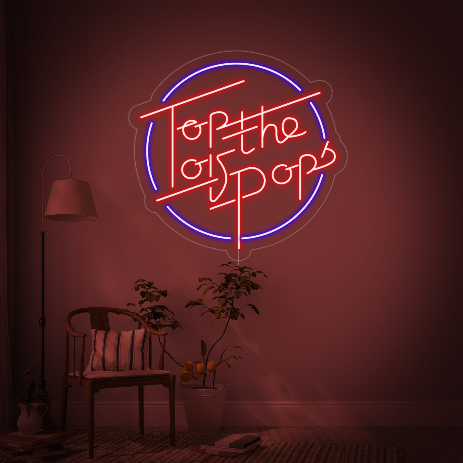 A brightly glowing 'Top Of The Pops' neon sign featuring red and yellow tubing with the classic logo design, mounted on a wall in a home entertainment area.